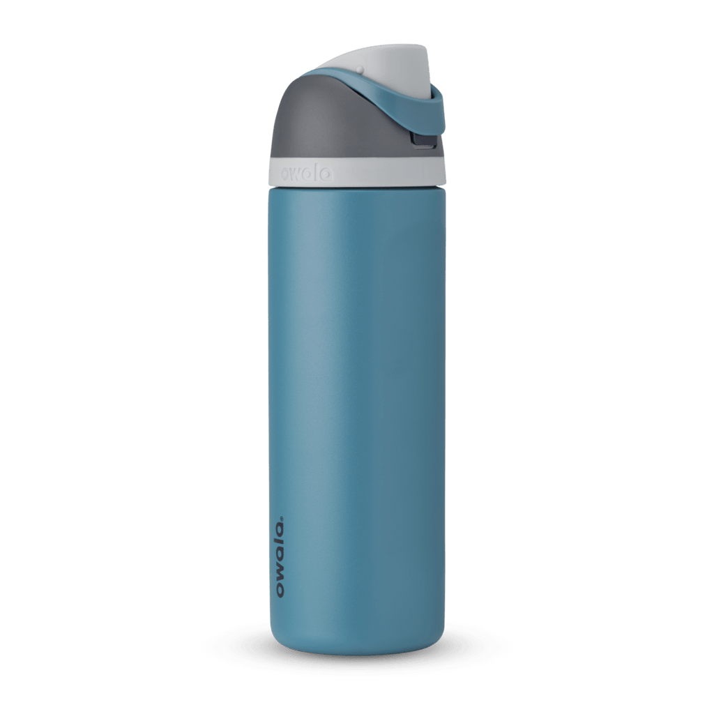 Owala FreeSip 24oz in Out of the Blue, periwinkle blue insulated bottle with matching blue-lavender flip cap and carry loop