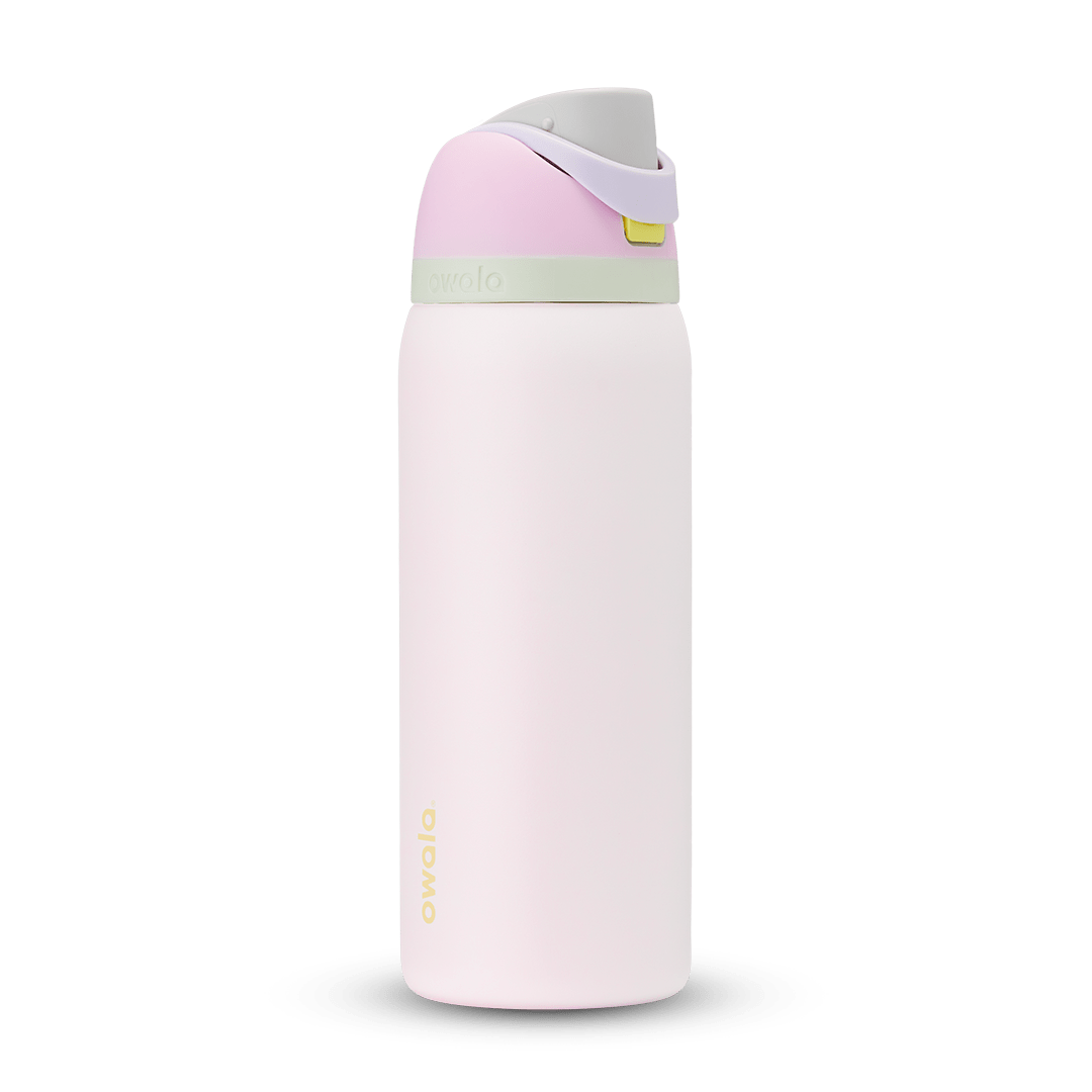 Owala FreeSip 24oz in Out of the Blue, periwinkle blue insulated bottle with matching blue-lavender flip cap and carry loop