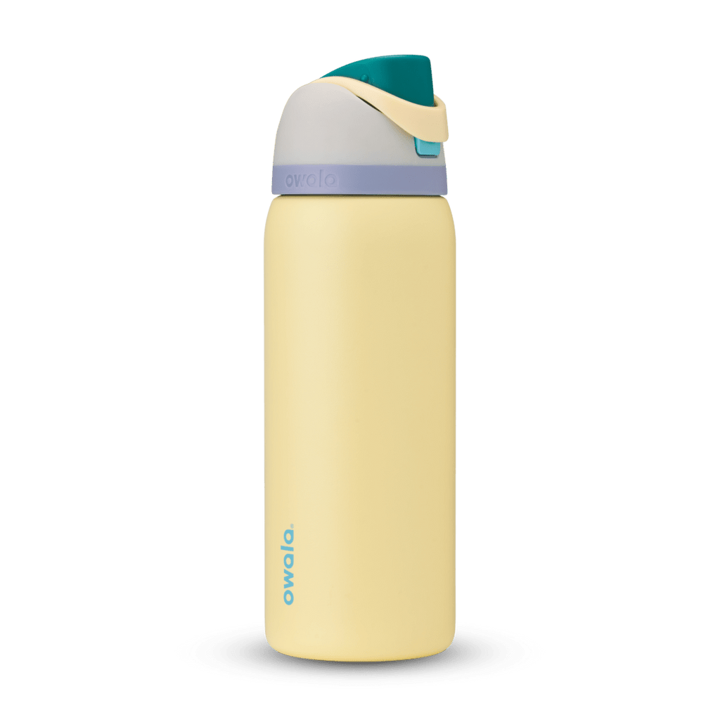 Owala FreeSip 24oz in Out of the Blue, periwinkle blue insulated bottle with matching blue-lavender flip cap and carry loop