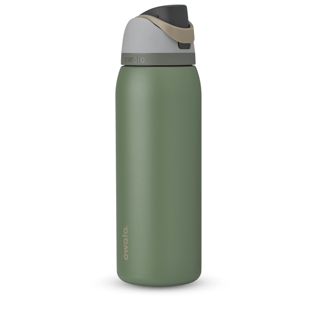 Owala FreeSip 24oz in Out of the Blue, periwinkle blue insulated bottle with matching blue-lavender flip cap and carry loop