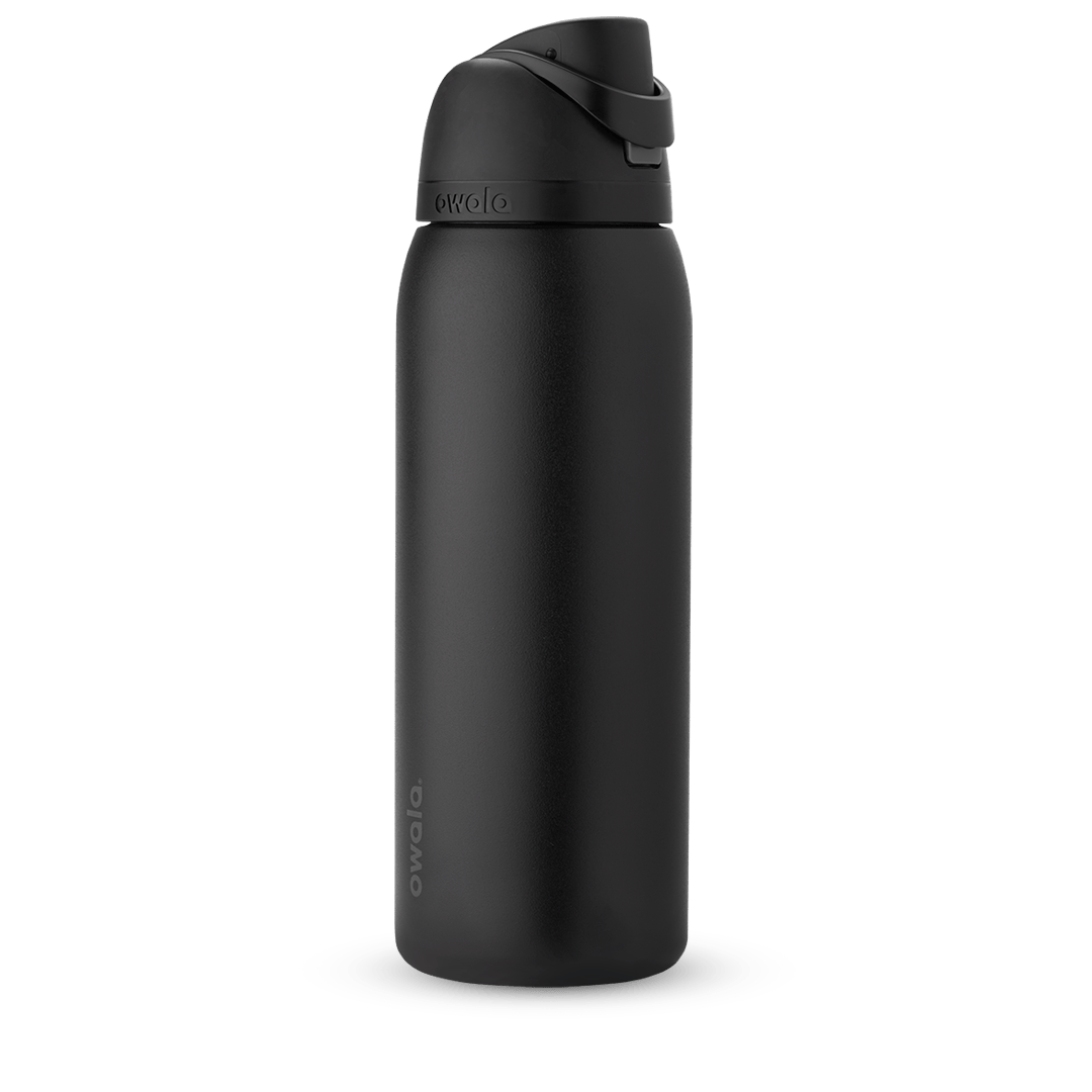 Owala FreeSip 24oz in Out of the Blue, periwinkle blue insulated bottle with matching blue-lavender flip cap and carry loop