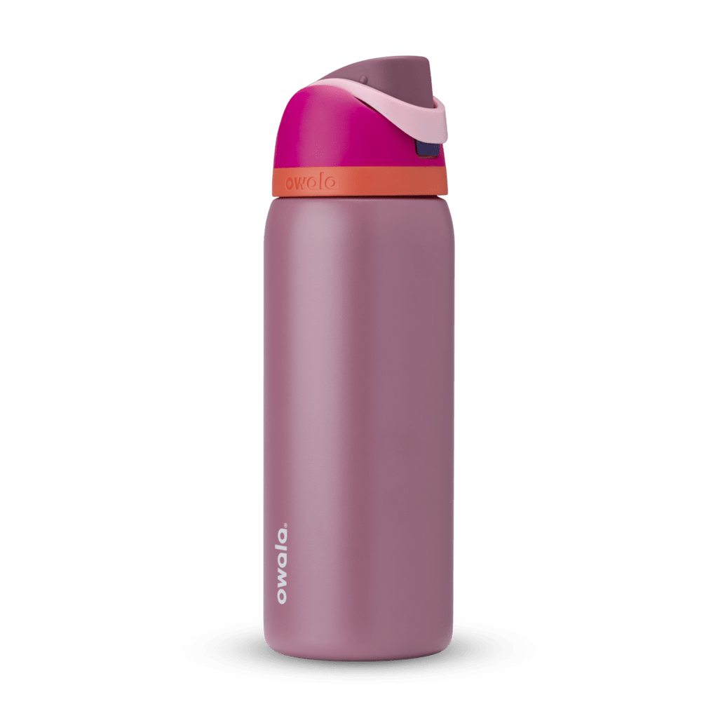 Owala FreeSip 24oz in Out of the Blue, periwinkle blue insulated bottle with matching blue-lavender flip cap and carry loop
