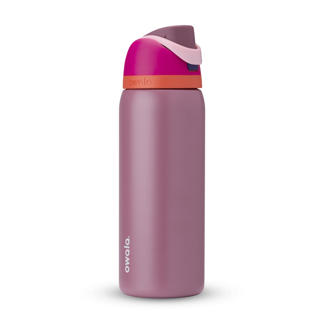 Owala FreeSip 24oz in Out of the Blue, periwinkle blue insulated bottle with matching blue-lavender flip cap and carry loop
