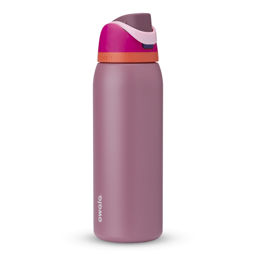 Owala FreeSip 24oz in Out of the Blue, periwinkle blue insulated bottle with matching blue-lavender flip cap and carry loop