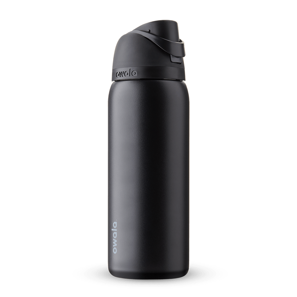 Owala FreeSip 24oz in Out of the Blue, periwinkle blue insulated bottle with matching blue-lavender flip cap and carry loop