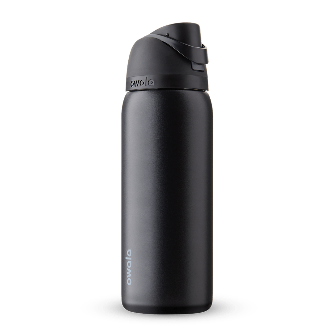 Owala FreeSip 24oz in Out of the Blue, periwinkle blue insulated bottle with matching blue-lavender flip cap and carry loop