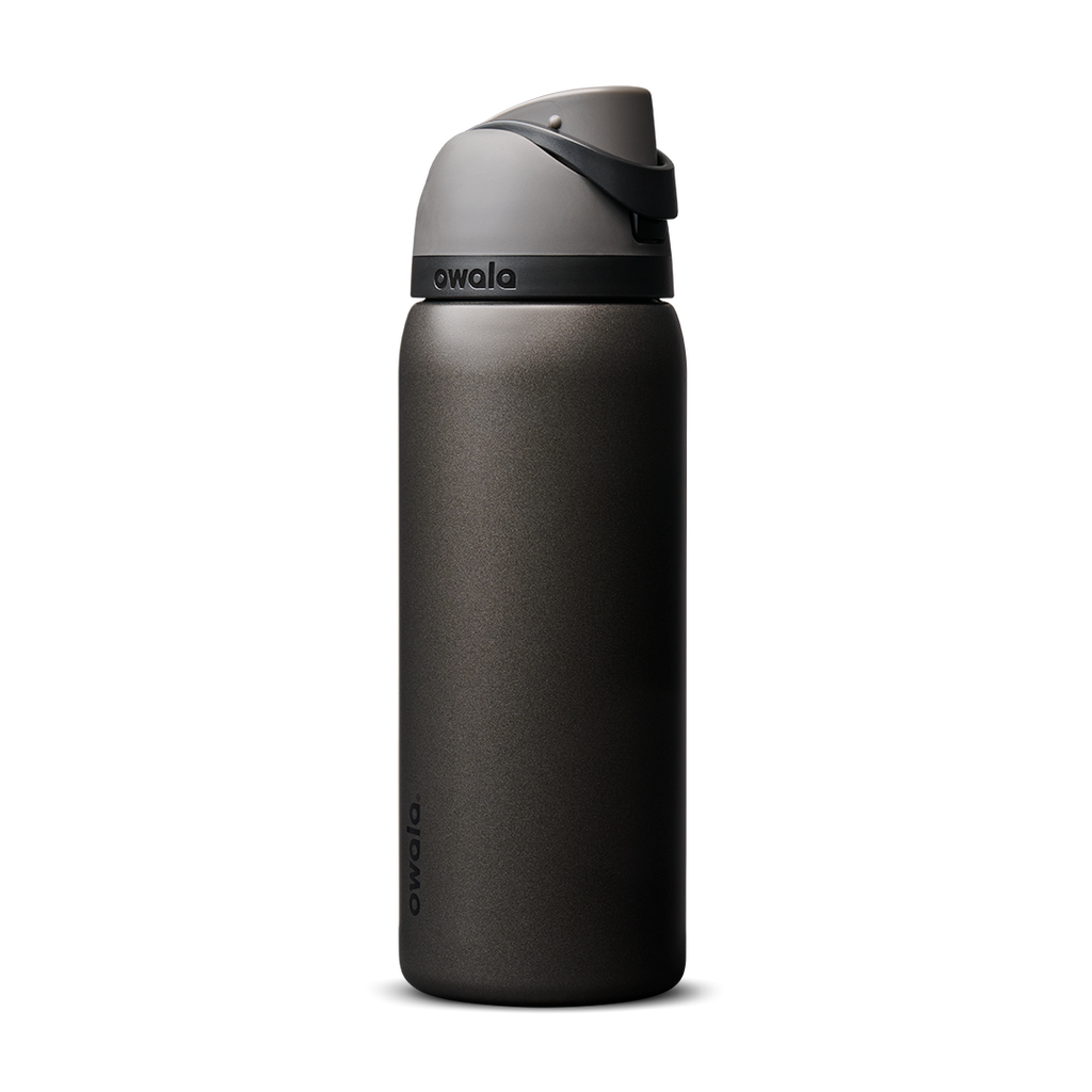 Owala FreeSip 24oz in Out of the Blue, periwinkle blue insulated bottle with matching blue-lavender flip cap and carry loop