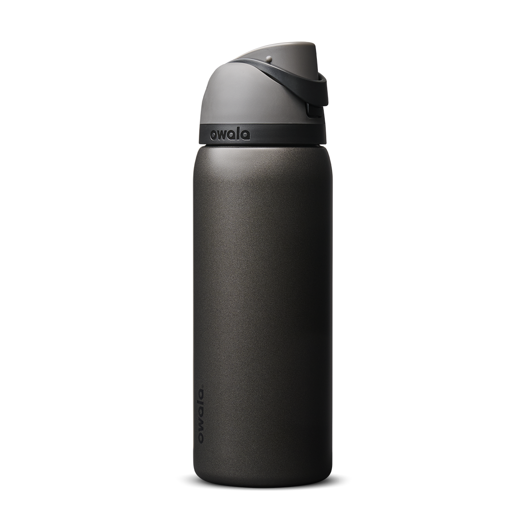 Owala FreeSip 24oz in Out of the Blue, periwinkle blue insulated bottle with matching blue-lavender flip cap and carry loop