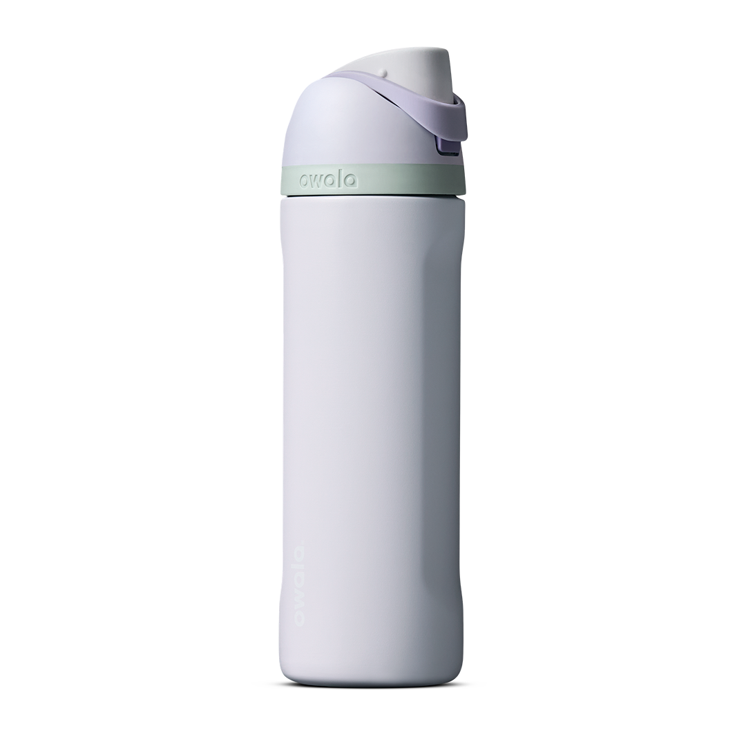 Owala FreeSip 24oz in Out of the Blue, periwinkle blue insulated bottle with matching blue-lavender flip cap and carry loop