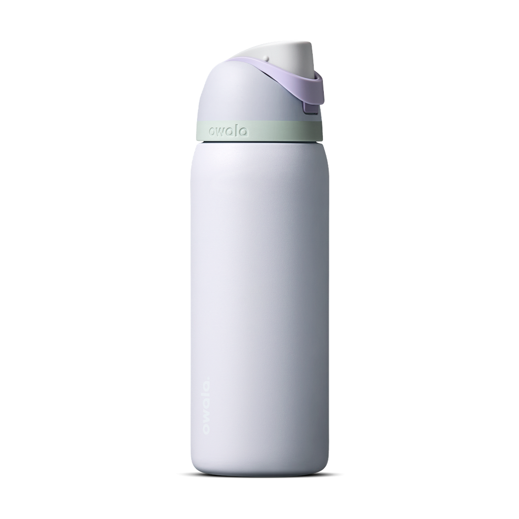Owala FreeSip 24oz in Out of the Blue, periwinkle blue insulated bottle with matching blue-lavender flip cap and carry loop