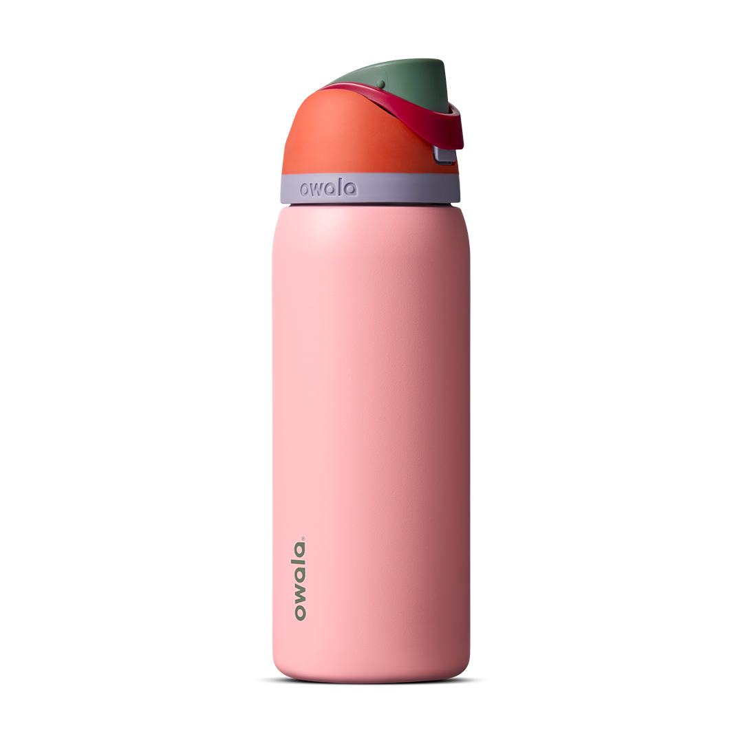 Owala FreeSip 24oz in Out of the Blue, periwinkle blue insulated bottle with matching blue-lavender flip cap and carry loop