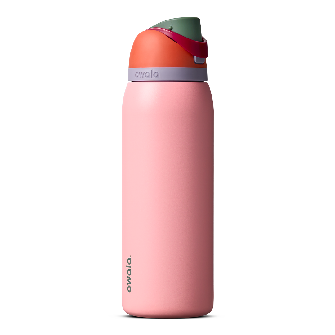 Owala FreeSip 24oz in Out of the Blue, periwinkle blue insulated bottle with matching blue-lavender flip cap and carry loop