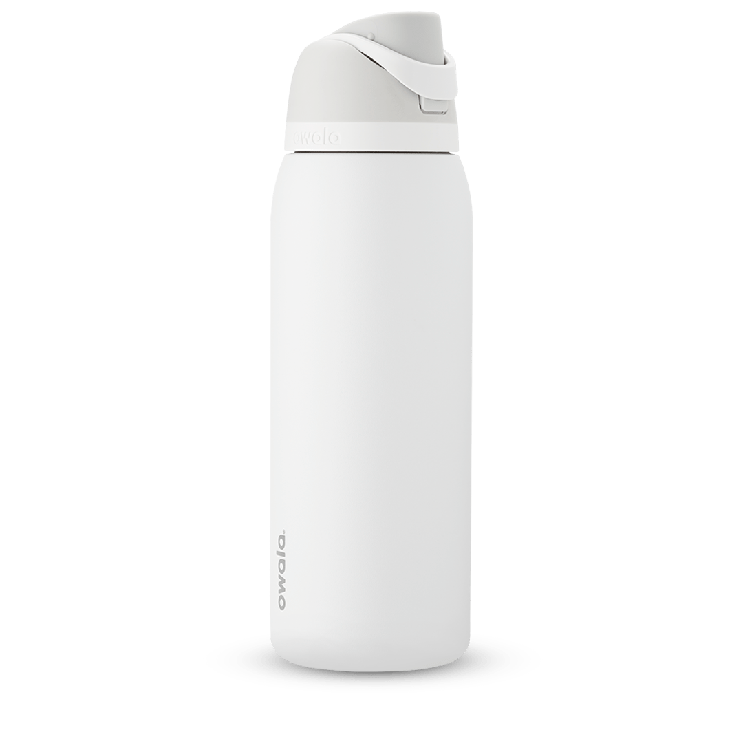 Owala FreeSip 24oz in Out of the Blue, periwinkle blue insulated bottle with matching blue-lavender flip cap and carry loop