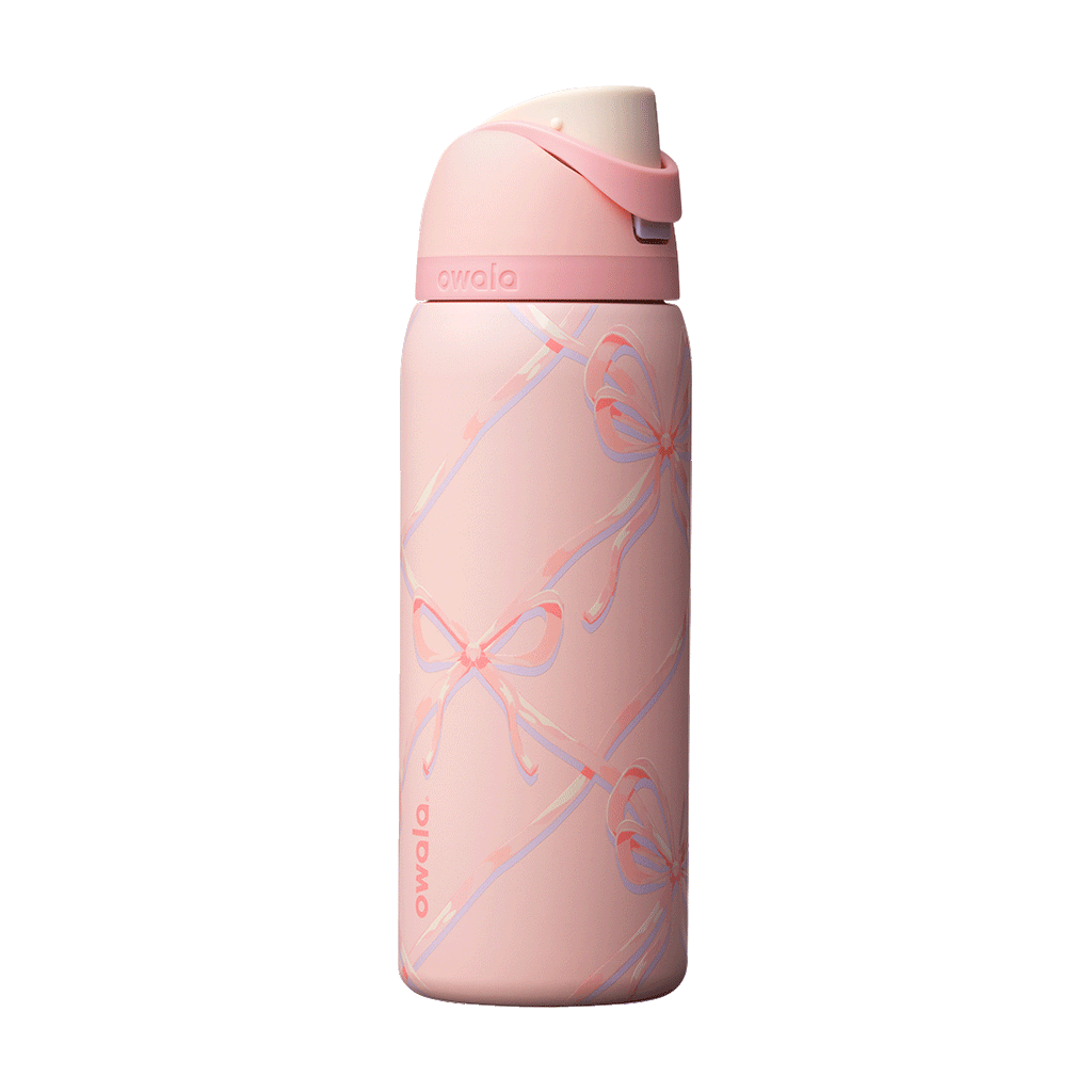 Owala FreeSip 24oz in Out of the Blue, periwinkle blue insulated bottle with matching blue-lavender flip cap and carry loop