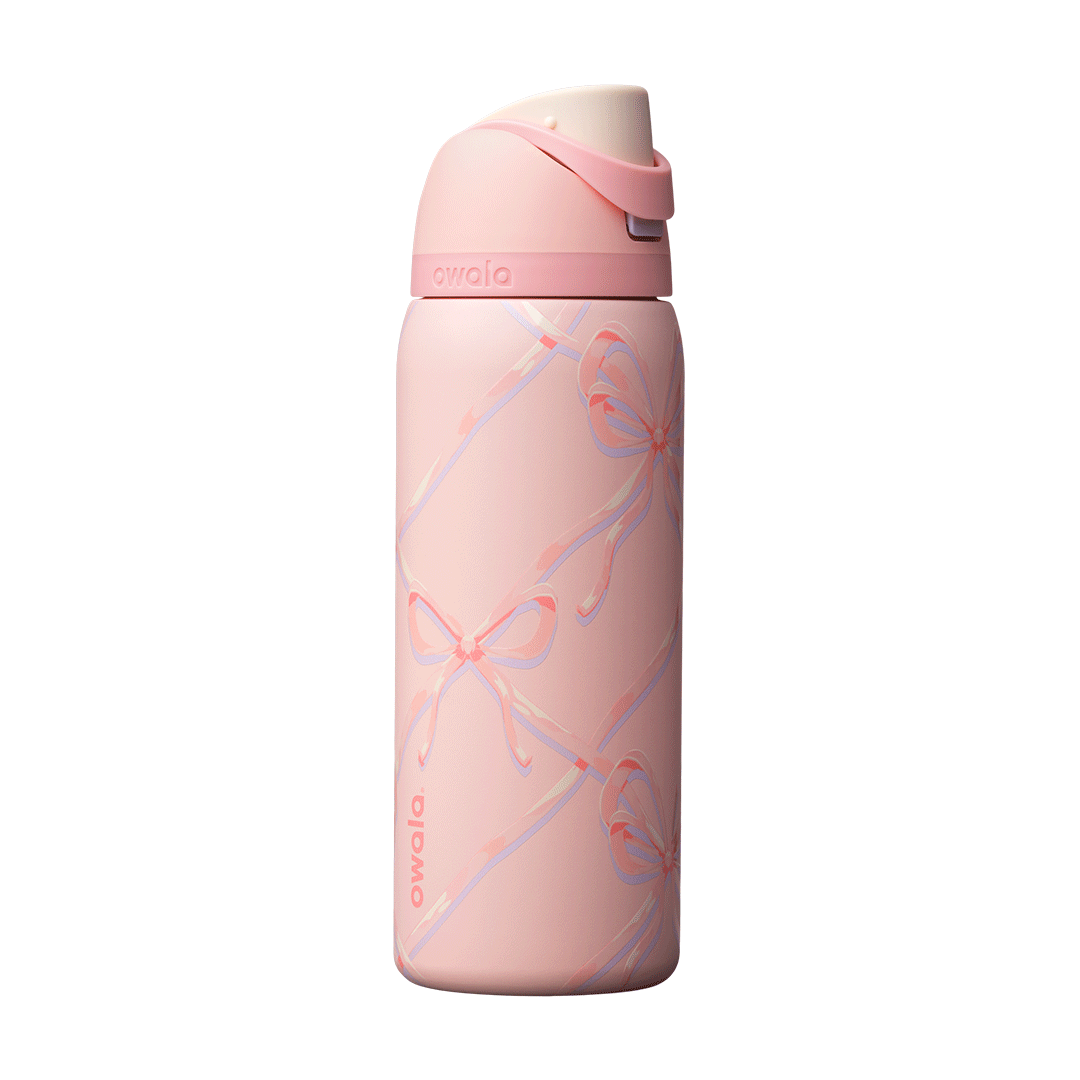 Owala FreeSip 24oz in Out of the Blue, periwinkle blue insulated bottle with matching blue-lavender flip cap and carry loop